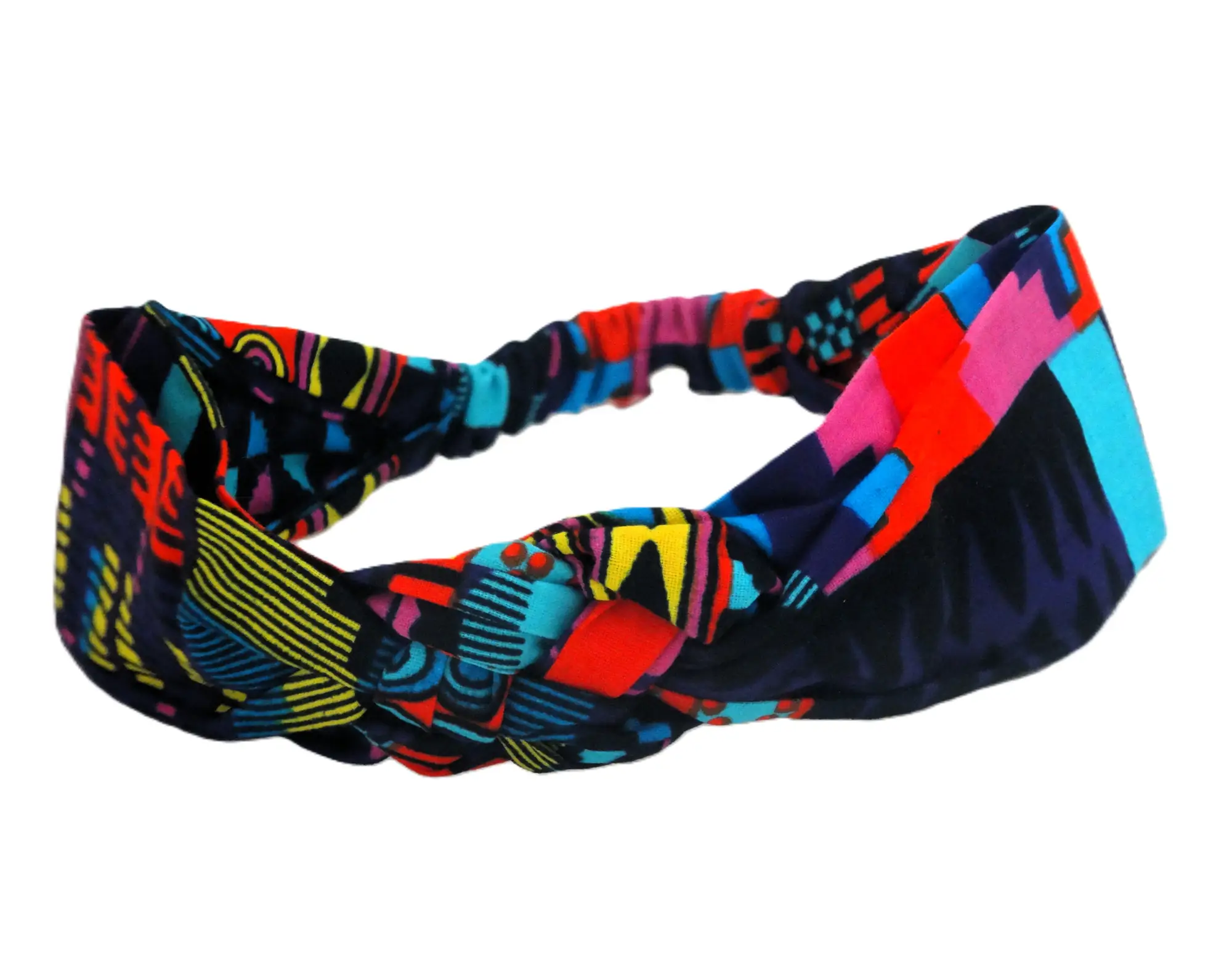 Vista lateral de la diadema artesanal de MARTIU, mostrando la banda elástica posterior y la continuidad de sus patrones textiles llenos de color y personalidad.